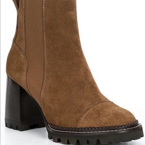 Brand new never worn heel booties. They run small perfect for a size 7.